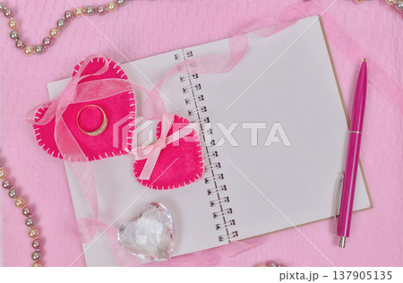 Valentines day hearts and notepad for your text. Top view on wooden table Valentines day hearts and notepad for your text. Top view on wooden table 137905135