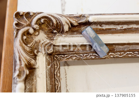 Wooden Frame With Intricate Design Displayed on a Table in a Studio During Daylight Wooden Frame With Intricate Design Displayed on a Table in a Studio During Daylight 137905155