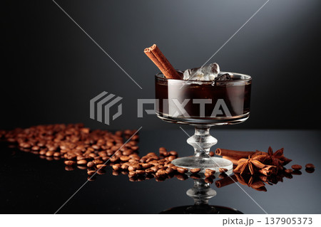 Coffee cocktail with ice on a black background. Coffee cocktail with ice on a black background. 137905373