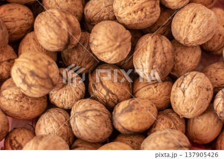 Whole walnuts background, healthy nutrition ingredient 137905426