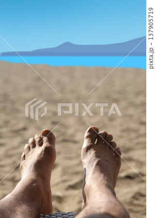 couple feet on beach couple feet on beach 137905719