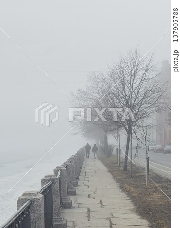 City embankment in dense fog City embankment in dense fog 137905788