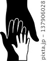 Silhouette of large adult hand and small child hand together for protection and family concept 137906028