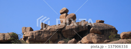 Phallus shaped granite boulders near Hampi, Karnataka, India. 137906338