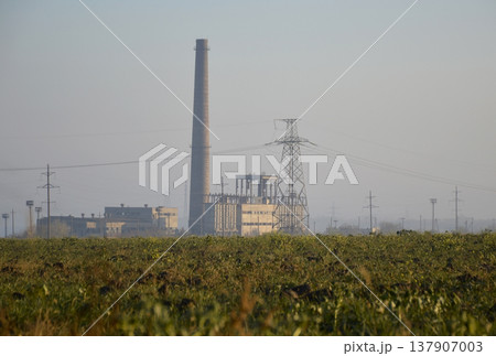 power plant in the rays of the sun at dawn 137907003
