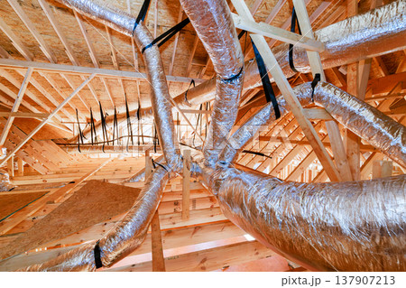 Ductwork installation in residential building under construction 137907213