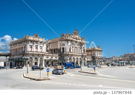 Genoa, liguria, italy. May 18, 2024. Genoa brignole railway station facade standing prominently in the city center with vehicles moving on the surrounding roads Genoa, liguria, italy. May 18, 2024. Genoa brignole railway station facade standing prominently in the city center with vehicles moving on the surrounding roads 137907848