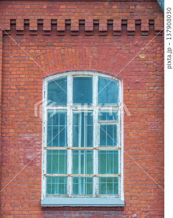 The window of the old mansion 19 century with brown bricks wall The window of the old mansion 19 century with brown bricks wall 137908030