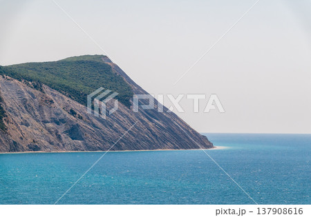 High mountain slopes to the Black Sea coast in Anapa, Russia. Coastline in sunset, beautiful sea scenery. Anapa coast landscape, high cliff High mountain slopes to the Black Sea coast in Anapa, Russia. Coastline in sunset, beautiful sea scenery. Anapa coast landscape, high cliff 137908616