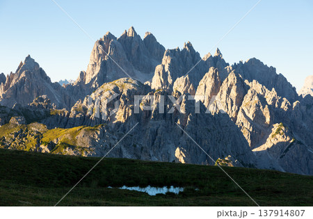 Amazing views of the picturesque high Dolomites mountains, lawns and forest Amazing views of the picturesque high Dolomites mountains, lawns and forest 137914807