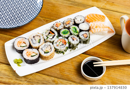 On table there portion set with maki - uramaki and nigiri 137914830