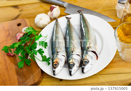 Raw mackerel fish served to table Raw mackerel fish served to table 137915005