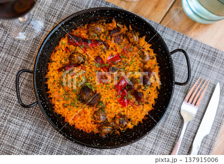 Traditional Valencian rice paella with snails Traditional Valencian rice paella with snails 137915006