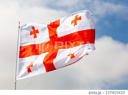 Flag of Georgia on background of sky Flag of Georgia on background of sky 137915423