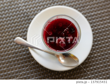 Yogurt is decorated and covered with maroon jelly made from wild berries. Yogurt is decorated and covered with maroon jelly made from wild berries. 137915431