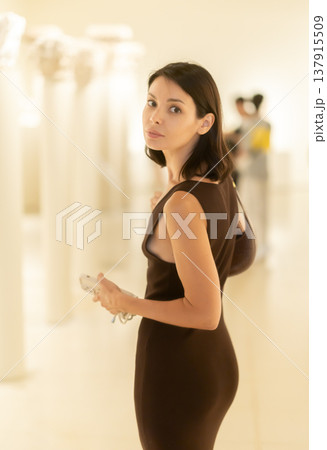 Young woman visiting a modern exhibition 137915509