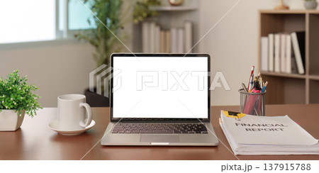 Professional desk setup with financial report and laptop Professional desk setup with financial report and laptop 137915788