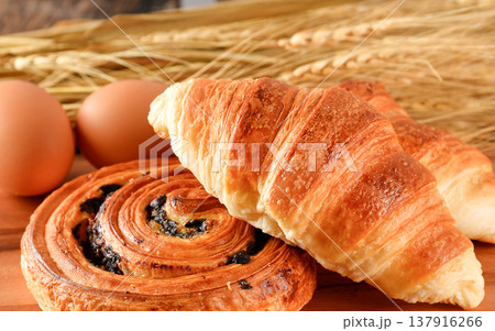 resh bread croissant and danish wheat on the wooden. resh bread croissant and danish wheat on the wooden. 137916266