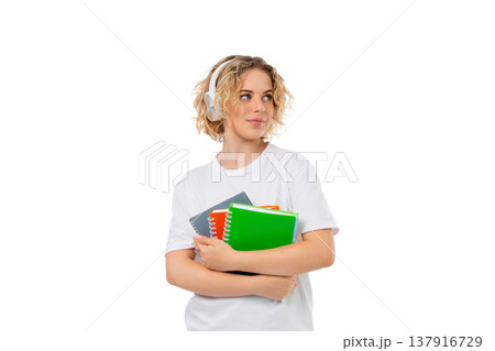 A woman with notebooks and headphones studies, isolated, PNG A woman with notebooks and headphones studies, isolated, PNG 137916729