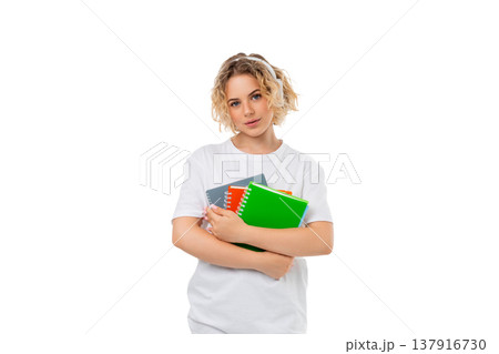 A woman stands holding three notebooks, isolated, PNG A woman stands holding three notebooks, isolated, PNG 137916730