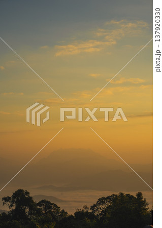 sunrise with moving of cloud and clear sky and layer of mountain sunrise with moving of cloud and clear sky and layer of mountain 137920330