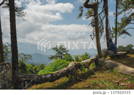 sunrise with man see moving of cloud and clear sky and layer of mountain 137920335