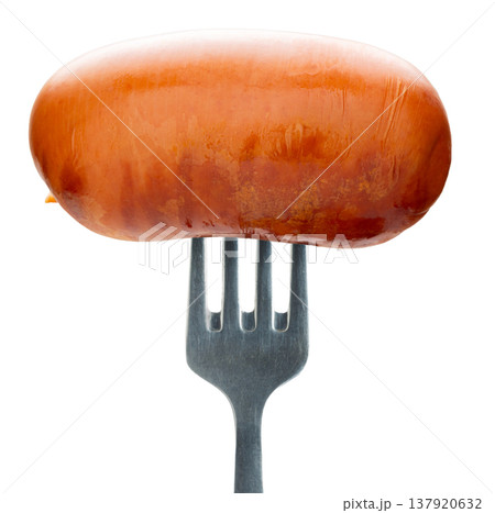 Appetizing sausage on a fork, isolated on white background 137920632