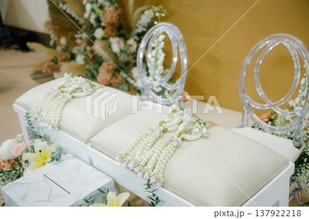 Traditional Thai Wedding Water Pouring Ceremony Setup with Flower Garlands Traditional Thai Wedding Water Pouring Ceremony Setup with Flower Garlands 137922218