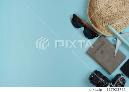 Travel essentials on blue background Travel essentials on blue background 137923723