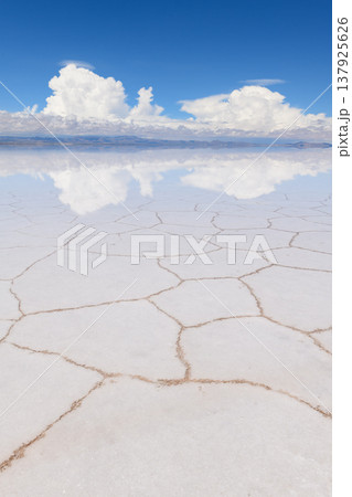 Surreal Salar de Uyuni salt flat with mirror reflection sky in Bolivia Surreal Salar de Uyuni salt flat with mirror reflection sky in Bolivia 137925626