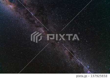 Awe inspiring milky way galaxy stretching across starry night sky 137925658
