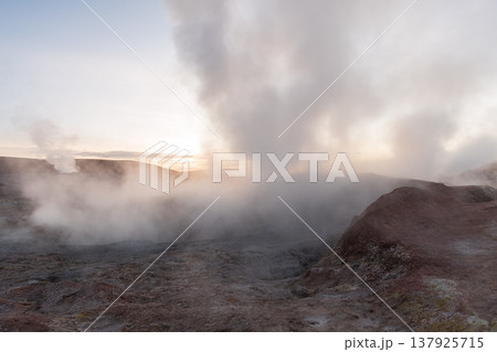 Powerful geyser erupting steam at sunrise in Sol de Manana Bolivia 137925715
