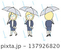 雨の日を通勤する金髪の外国人ビジネスマン 傘とバッグを持って歩く 3方向セット素材 137926820