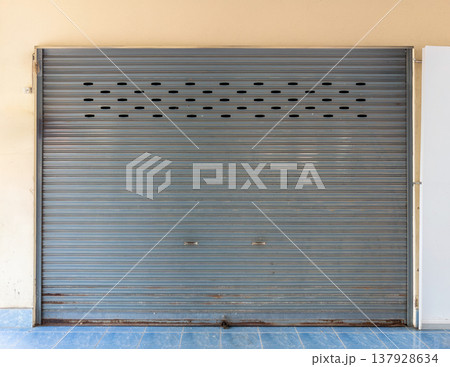 Gray Metal Rolling Shutter Door of School Building. Gray Metal Rolling Shutter Door of School Building. 137928634