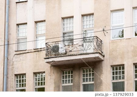 air conditioning on facade of building, air cooling in hot weather. air conditioning on facade of building, air cooling in hot weather. 137929033