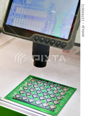 Digital microscope with LCD screen inspecting electronic circuit board in high resolution. 137930072