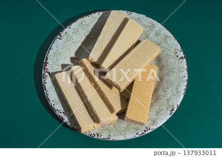 Wafers on plate with green background 137933011