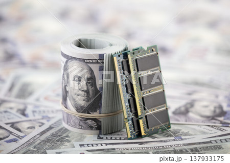 Computer memory ram on hundred dollar bills banknotes. Concept of rising memory prices, expensive PC components and AI-driven demand. 137933175