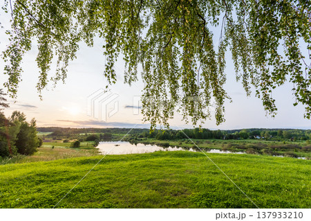 Golden sunset lights a tranquil Sorot river valley Golden sunset lights a tranquil Sorot river valley 137933210