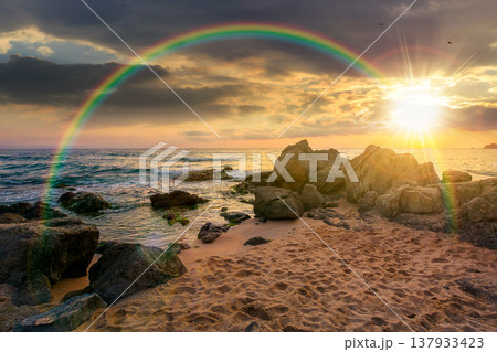 sunset over sandy beach landscape. beautiful coastal seascape scenery under the rainbow. nature background for summer vacation at the shore of black sea with rocks sunset over sandy beach landscape. beautiful coastal seascape scenery under the rainbow. nature background for summer vacation at the shore of black sea with rocks 137933423