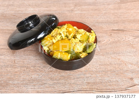 stir fried pumpkin mixed with egg vegetarian food on bowl with lid 137937177
