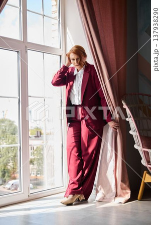 Elegant woman in office offers reassuring support during call 137938290
