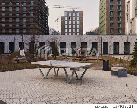 Public table tennis zone designed for residents in landscaped courtyard Public table tennis zone designed for residents in landscaped courtyard 137938321