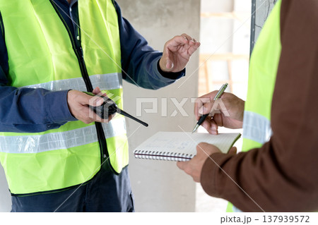 Foreman and supervisor are pointing Plastering work 137939572