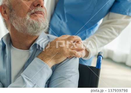 Help support retirement healthcare. Nurse helping old man in wheelchair. Patient and woman in nursing home for medical caregiver. Nurse taking care of paralyzed man in chair for people with disability Help support retirement healthcare. Nurse helping old man in wheelchair. Patient and woman in nursing home for medical caregiver. Nurse taking care of paralyzed man in chair for people with disability 137939798