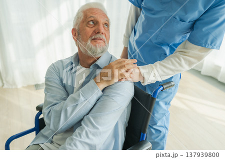 Help support retirement healthcare. Nurse helping old man in wheelchair. Patient and woman in nursing home for medical caregiver. Nurse taking care of paralyzed man in chair for people with disability Help support retirement healthcare. Nurse helping old man in wheelchair. Patient and woman in nursing home for medical caregiver. Nurse taking care of paralyzed man in chair for people with disability 137939800