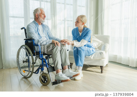 Help support retirement healthcare. Nurse helping old man in wheelchair. Patient and woman in nursing home for medical caregiver. Nurse taking care of paralyzed man in chair for people with disability 137939804