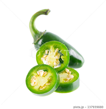 Fresh jalapeno pepper isolated on white background. Slices of green hot serrano pepper. Clipping path. Fresh jalapeno pepper isolated on white background. Slices of green hot serrano pepper. Clipping path. 137939880