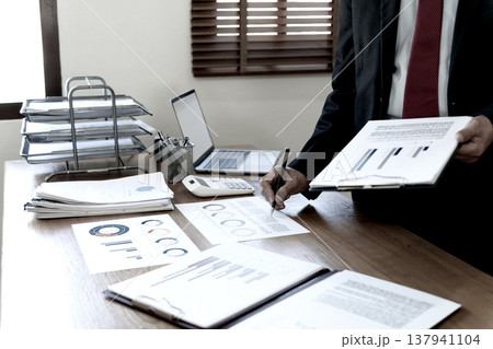 close up image of manager on desk, executive marketing analyst close up image of manager on desk, executive marketing analyst 137941104