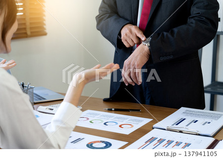 Manager showing dissatisfaction with subordinates late 137941105